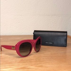 DOLCE AND GABBANA red sunglasses.